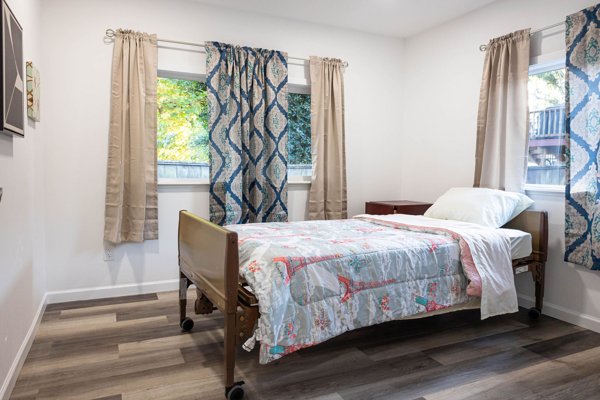 Bedroom with bed and two windows